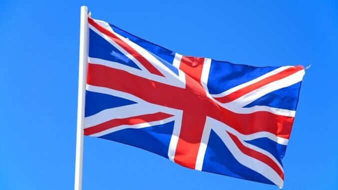 Union jack flag against a blue sky, UK. Union jack flag against a blue sky, UK.
