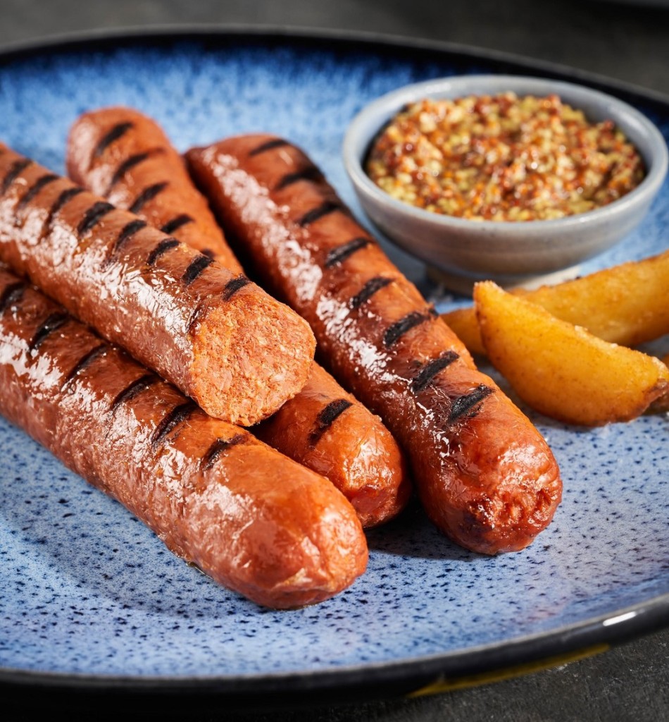 four heura chorizos on a plate