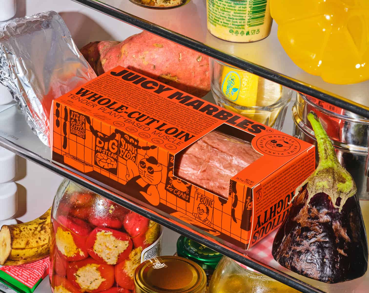 a box of juicy marbles' whole cut loin in a fridge