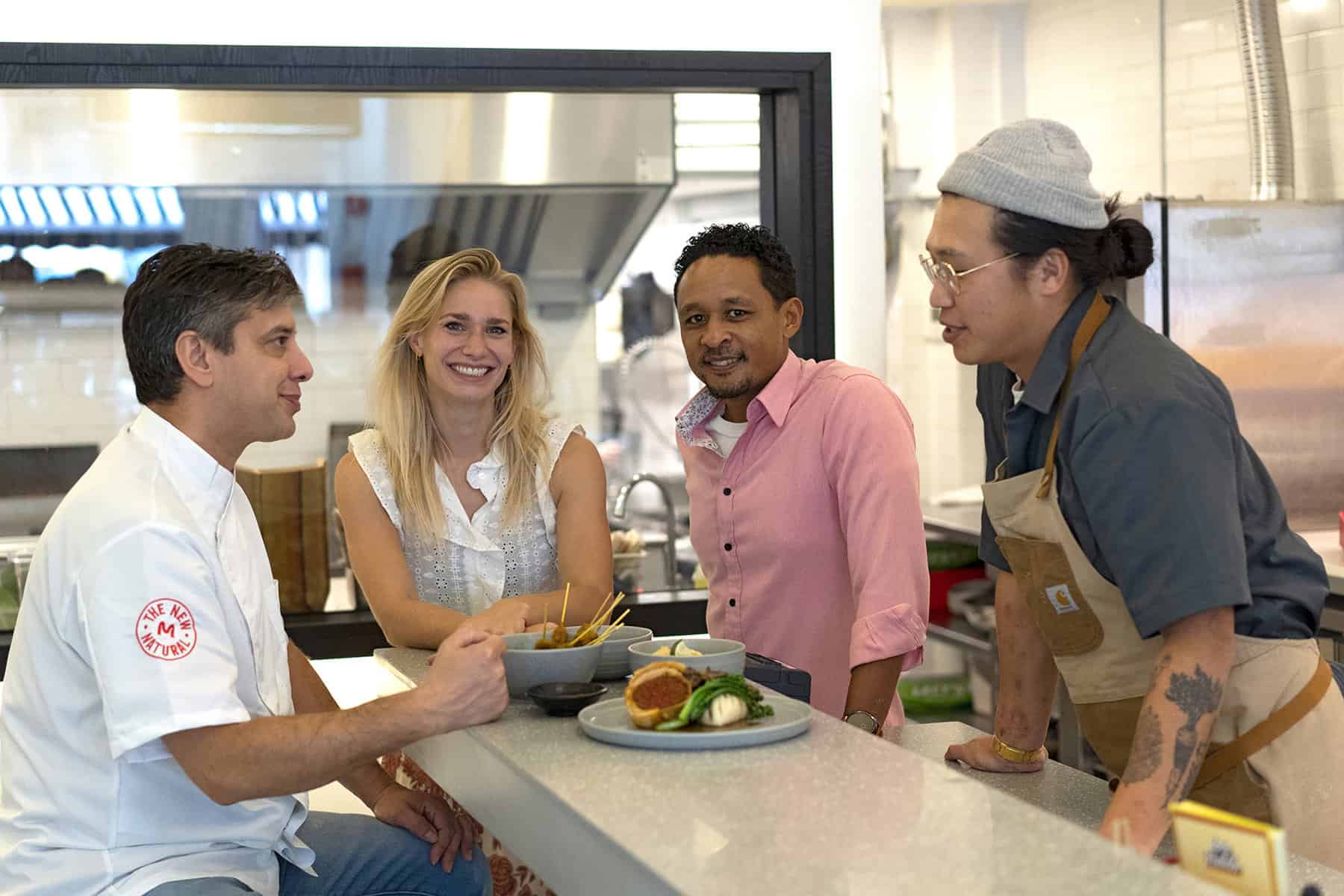 meatable's team sitting on a table with love handle's team