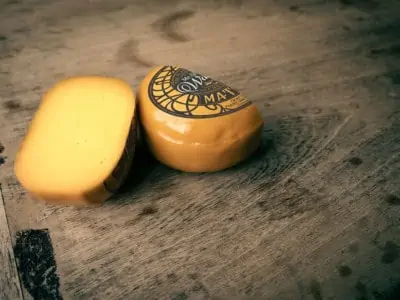 Mr & Mrs Watson cheese wheel cut in half